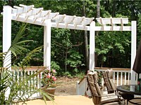 <b>A trellis adds a beautiful architectural structure to your space and gives the illusion of walls for an outdoor deck. This trellis creates quite a statement and frames both the view and the stairs leading away from the deck.</b>